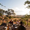 Outside dining setup with views of the wilderness at Nomad Lamai Serengeti