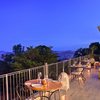 Rooftop dining area with views of Kampala at Latitude 0 Degrees Hotel