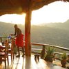 Samburu warrior prepping the dining area overlooking the valleys at Sabuk Lodge in Kenya