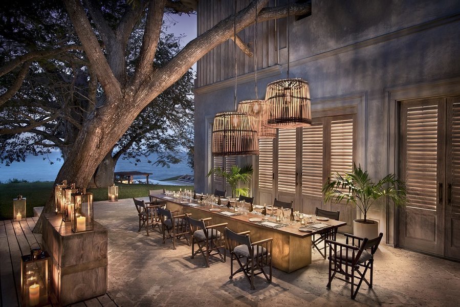 Sirai Beach outside dining area with exterior view of the house overlooking the Indian Ocean