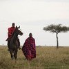The maasai on a horseback exploring the wilderness