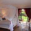 Room setup with views of the yard at Le Rustique Hotel in Nakuru