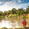 Maasai warriors overlooking the Mara River at Sentinel Mara Camp
