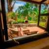 Outside relaxing area with views of the Garden at Simba Farm Lodge