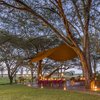 Outside dining setup on a deck at Sirikoi Lodge in Kenya