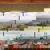 Dining area setup, infinity pool and views of the Loisaba Conservancy at Loisaba Lodo Springs