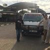 A picture of our guest with our safari van