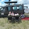 Kwezi Safaris guests at Maasai Mara enjoying picnic lunch while on a 10-day Kenya Tanzania Safari