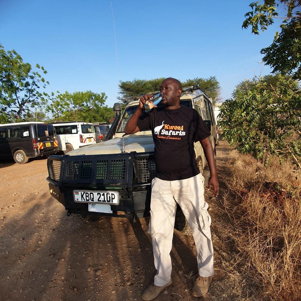 Kwezi Safaris top safari guide using our glass bottles