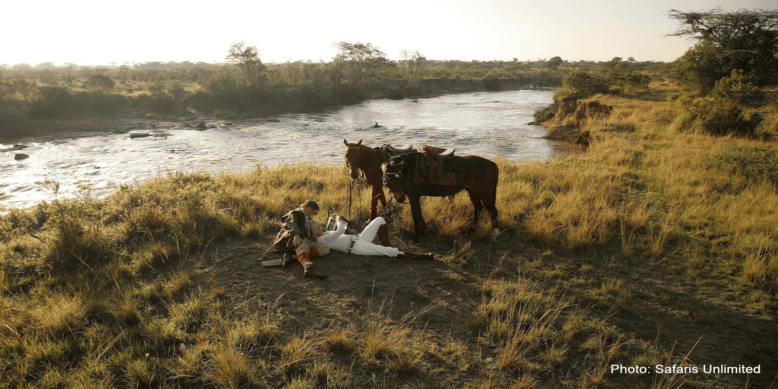Honeymooners relaxing after a long horseback ride.