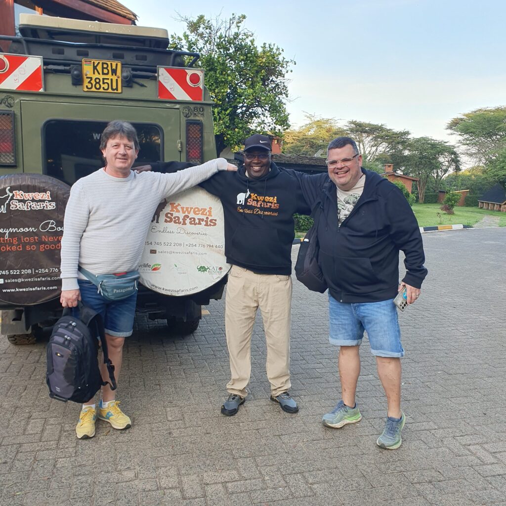 Our expert safari guide, Chege, with guests on a safari