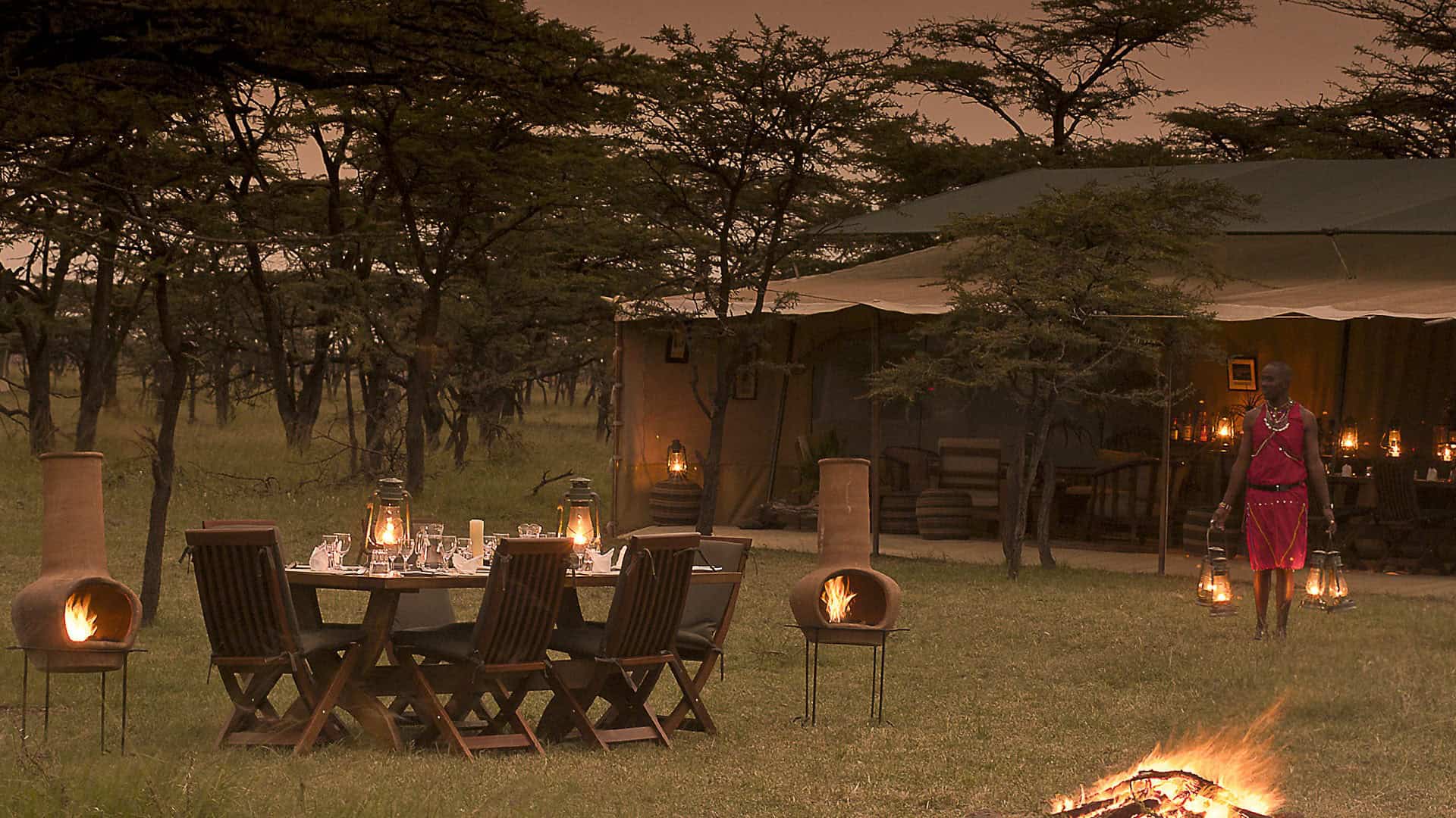 Outdoor dining setup and main tent at Kicheche Bush Camp