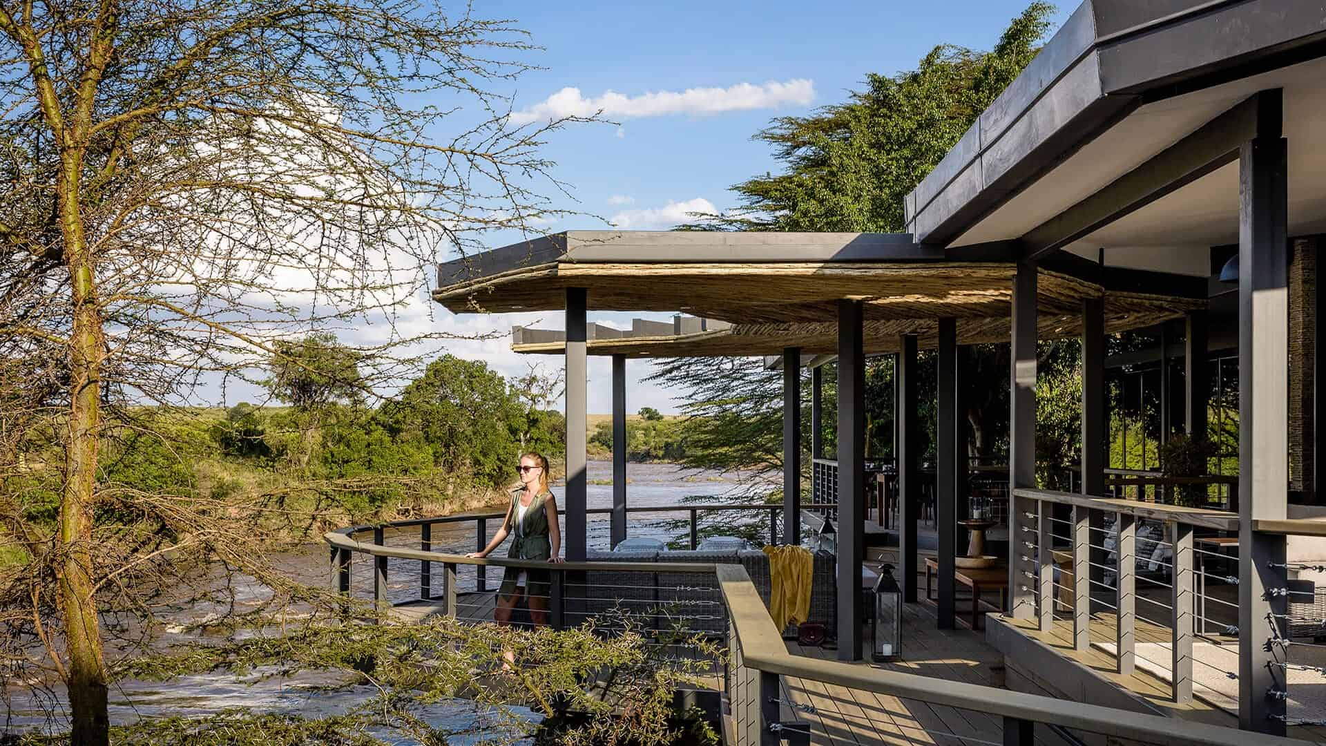 Main area at Sanctuary Olonana Camp set at the banks of the river