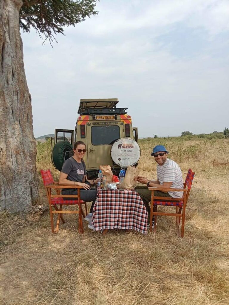 A couple having a picnic lunch in Masai Mara