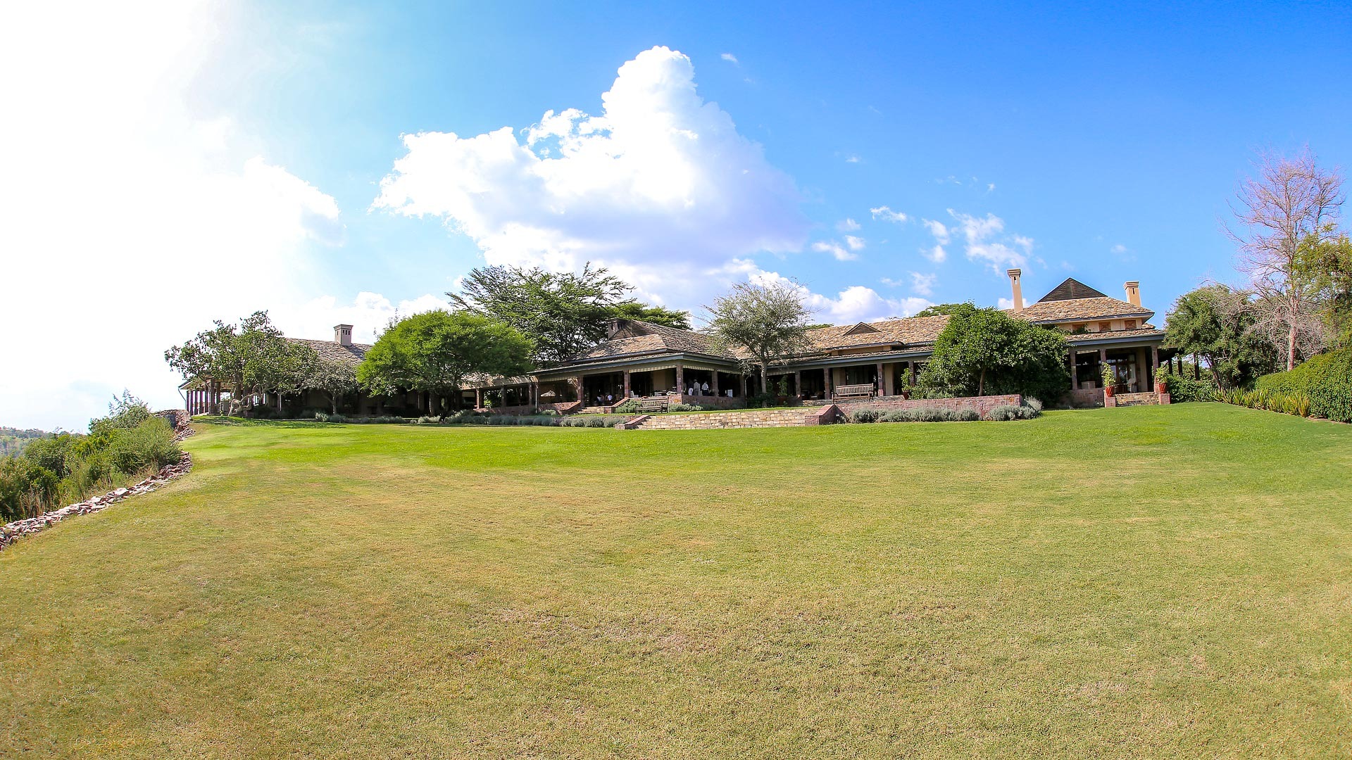 Exterior facade of the main lodge area at Singita Sasakwa Lodge