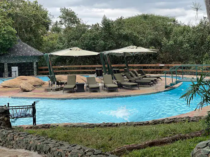A serene swimming pool with relaxing area in Tarangire Sopa Lodge